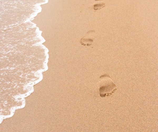 A single footprint on a clean path symbolizing a new beginning.